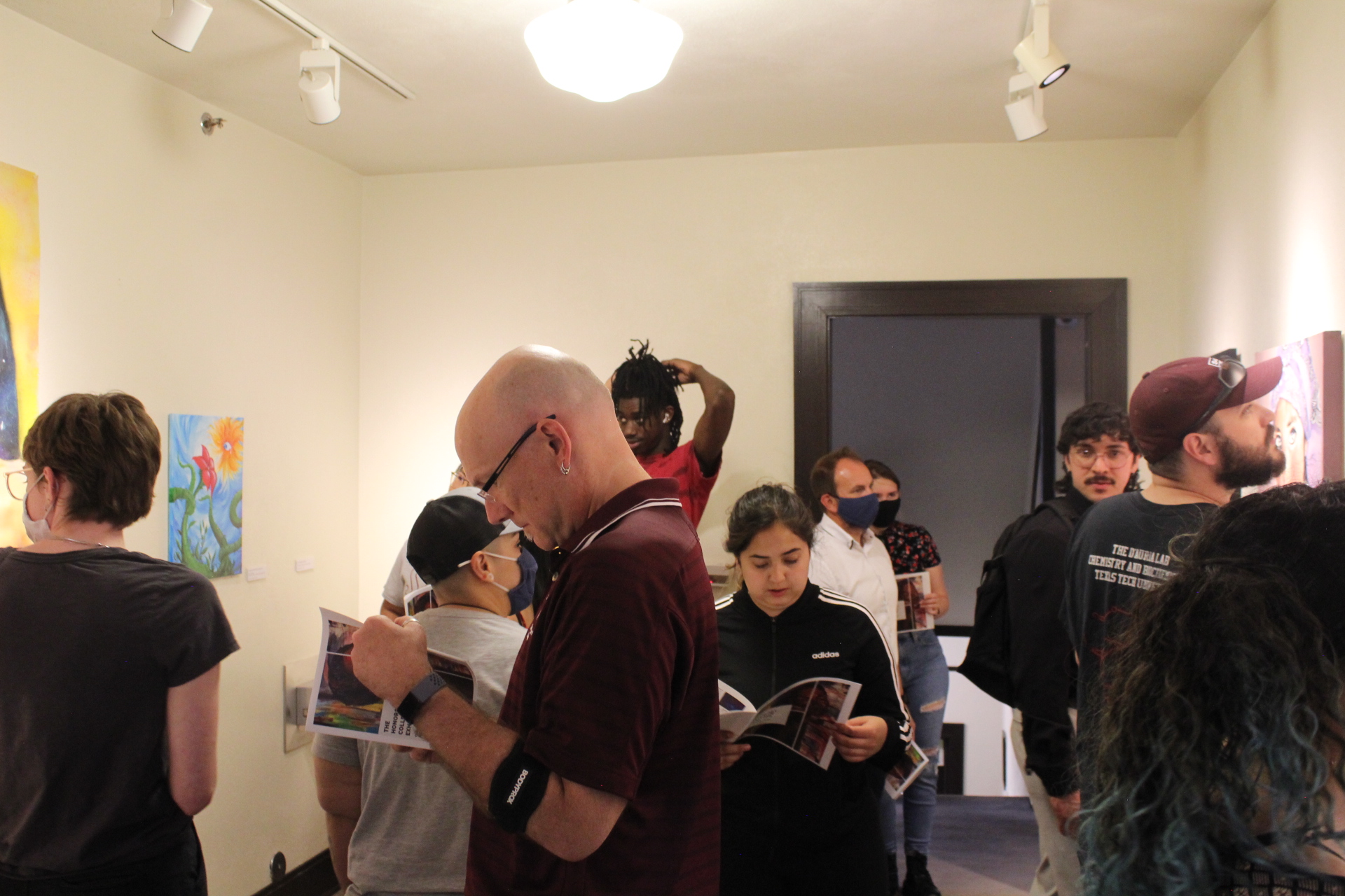 People looking at flyers