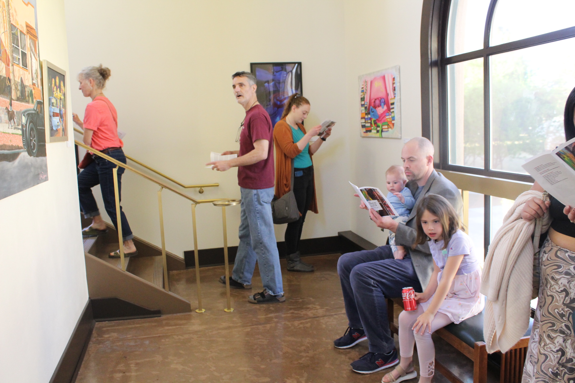 People looking at paintings