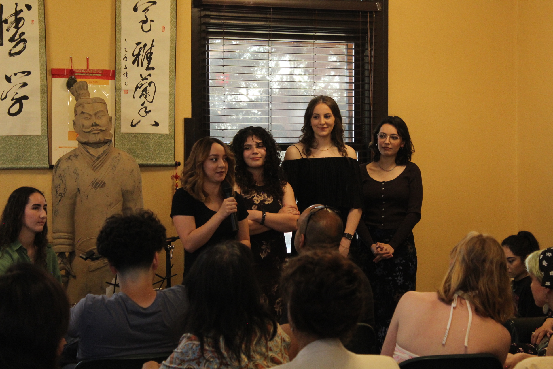 Group of people talking at the front
